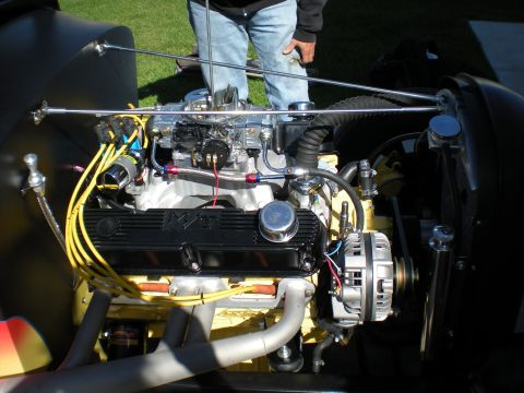 1974 Ford Ranchero - Custom V8 engine bay features chrome carburetor and yellow spark plug wires.