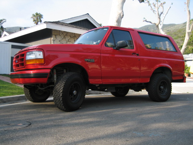 Red 1995 Ford Bronco 3/4 front view