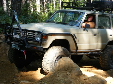 2005 Jeep Wrangler - This Toyota Land Cruiser is navigating a rocky off-road course, demonstrating its capabilities.