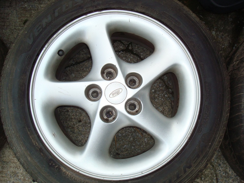Silver five-spoke alloy wheel with a Ventus tire.