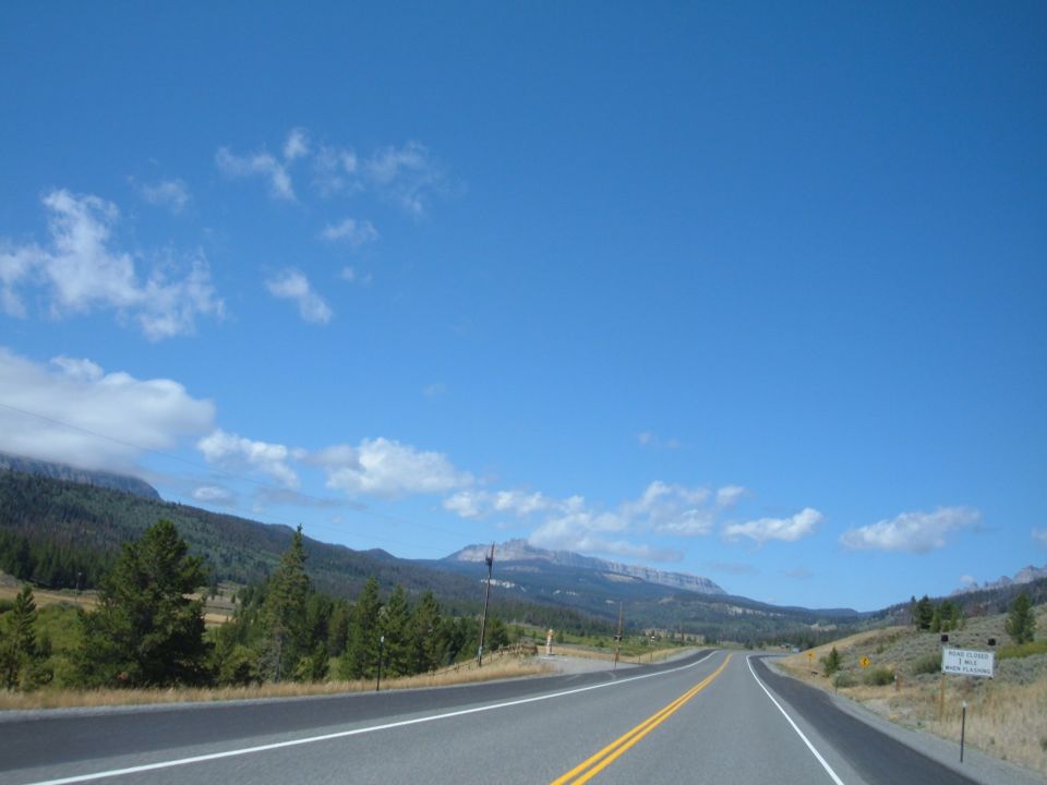 Mountainous landscape with a paved road.