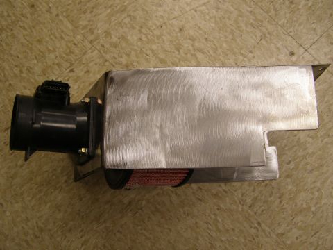 2003 Ford Crown Victoria - A custom aluminum intake box is shown attached to a black mass airflow sensor. A red cone air filter is visible inside the box.