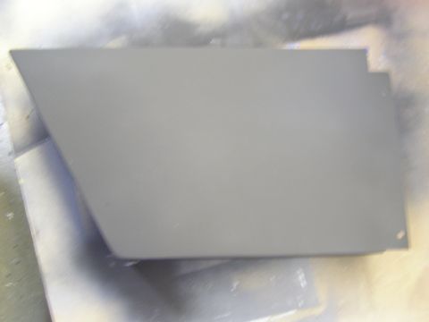 2003 Ford Crown Victoria - A gray painted car part, possibly a fender or door panel, is shown from a top-down angle. The part has a clean, smooth finish and appears t…
