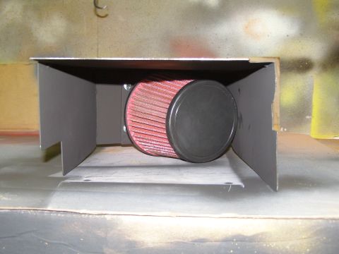 2003 Ford Crown Victoria - A custom air intake system with a red cone filter and black end cap is housed within a dark gray metal box. The box appears to be mounted o…