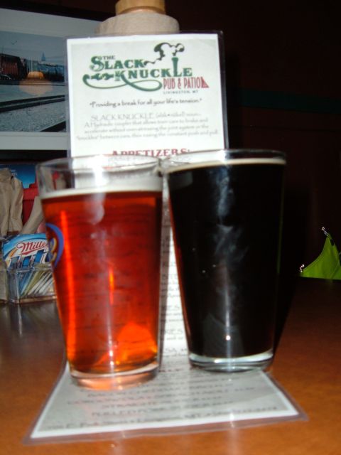 1998 BMW R1100GS ABS - A tasting of two beers, one amber and one dark, presented with a sign.