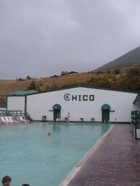 1998 BMW R1100GS ABS - Chico building and swimming pool scene under a cloudy sky.