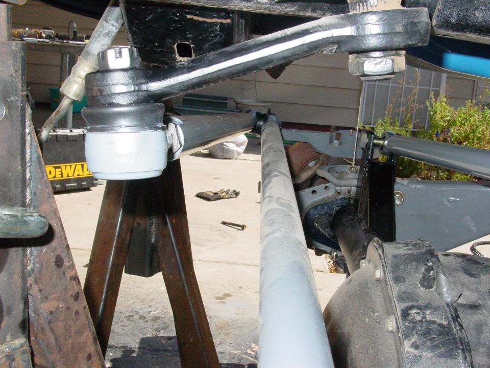 Ball joint and tie rod assembly on jack stands, with a DeWalt toolbox in background