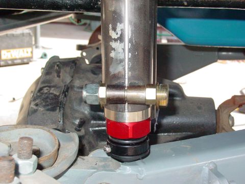 1979 Ford Bronco - Aftermarket shock absorber mount with custom hardware and red anodized components.