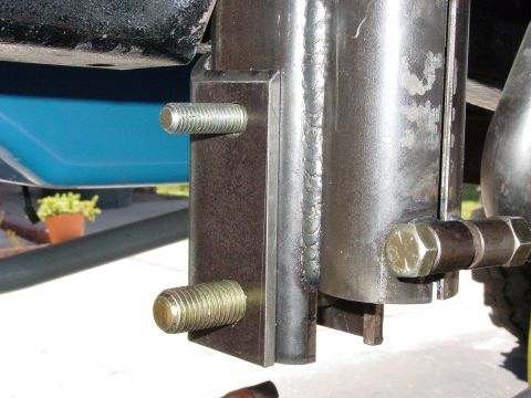 1979 Ford Bronco - Close-up view of a custom suspension component, highlighting its bolted and welded construction.