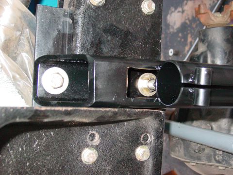 1979 Ford Bronco - Detail of a vehicle's suspension system, showing metal parts and fasteners.