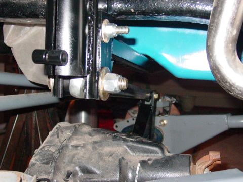 1979 Ford Bronco - Detail view of vehicle suspension system components, showing shock absorber and mounting hardware.