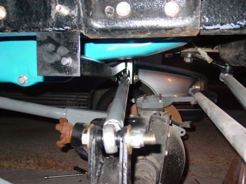 1979 Ford Bronco - This image shows the underside of a vehicle, focusing on suspension and drivetrain components.