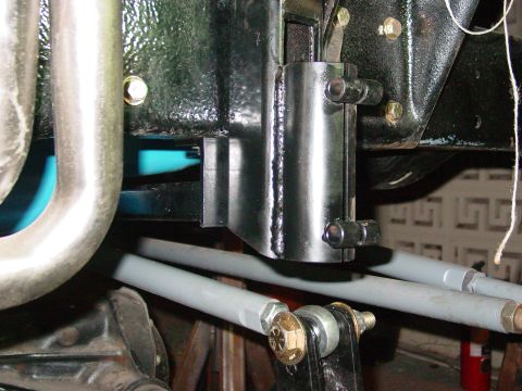 1979 Ford Bronco - Undercarriage view of vehicle suspension components, including tie rods and mounting hardware.