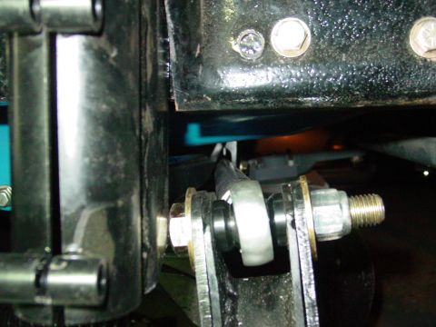 1979 Ford Bronco - Detail of a vehicle suspension component, likely part of the front suspension system.