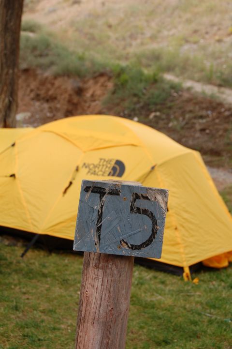 1998 BMW R1100GS ABS - Campsite scene a yellow tent and a wooden post with the number 75 visible.