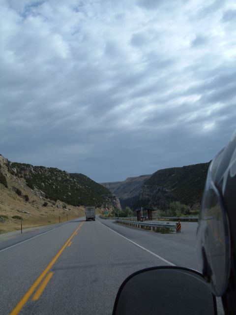 1998 BMW R1100GS ABS - Riding on a highway through a mountainous landscape with a truck in the distance.