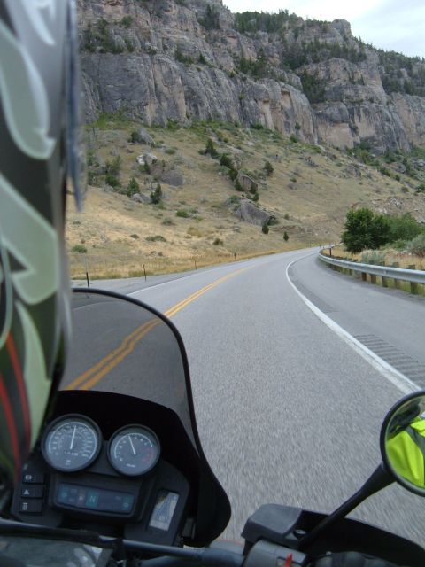 1998 BMW R1100GS ABS - Riding on a highway through a mountainous area, with a view of the dashboard and the road ahead.