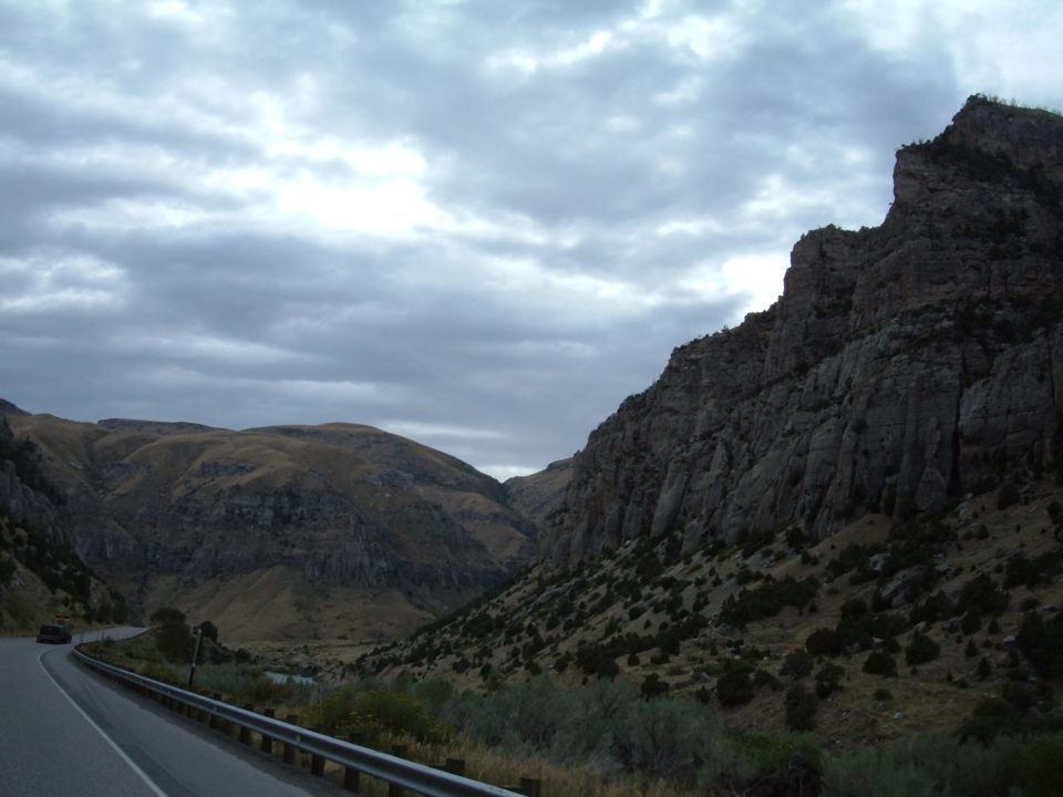 Motorcycle on a winding road through a mountain pass