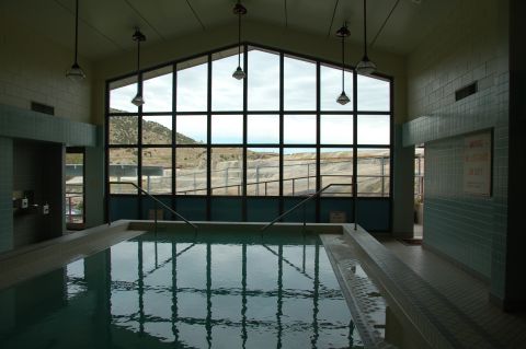 1998 BMW R1100GS ABS - An indoor swimming pool area with a large, multi-paned window offering a view of the outdoors.