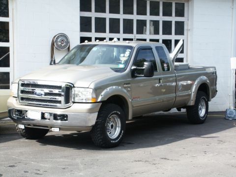 2001 Mercury Grand Marquis - This Ford F-250 Super Duty pickup truck is parked in front of a large garage door, with a toolbox mounted in the bed.