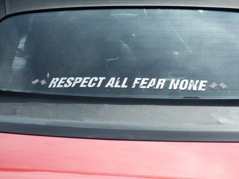 2001 Mercury Grand Marquis - A rear window sticker with the phrase "RESPECT ALL FEAR NONE" is visible on the back of a vehicle.