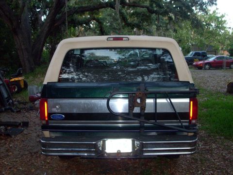 1992 Ford Bronco - Rear view of a 1992 Ford Bronco, showing its tailgate and spare tire mount.