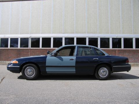 2001 Ford Crown Victoria - This Ford Crown Victoria has a two-tone paint job, with the front half a lighter blue and the rear half a darker blue.