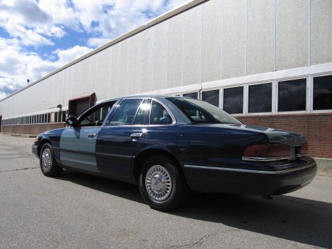 2001 Ford Crown Victoria - Photograph of a two-tone blue Ford Crown Victoria, not a technical document.