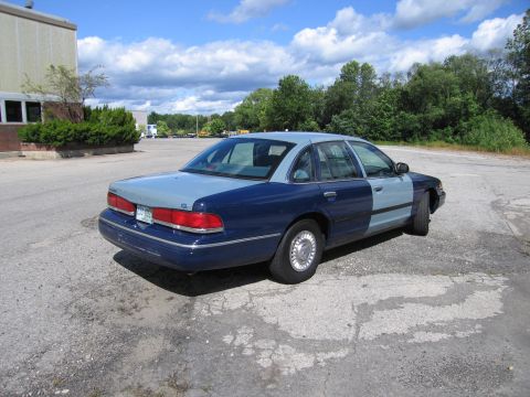 2001 Ford Crown Victoria - Photograph of a two-tone blue Ford Crown Victoria sedan, not a technical document.