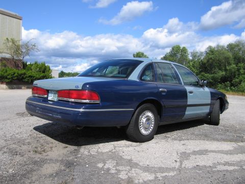2001 Ford Crown Victoria - Photograph of a two-tone blue Ford Crown Victoria, not a technical document.