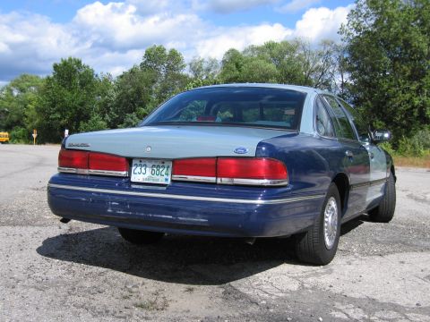 2001 Ford Crown Victoria - Photograph of a two-tone blue Ford Crown Victoria, not a technical document.