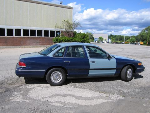2001 Ford Crown Victoria - Photograph of a two-tone blue Ford Crown Victoria, not a technical document.