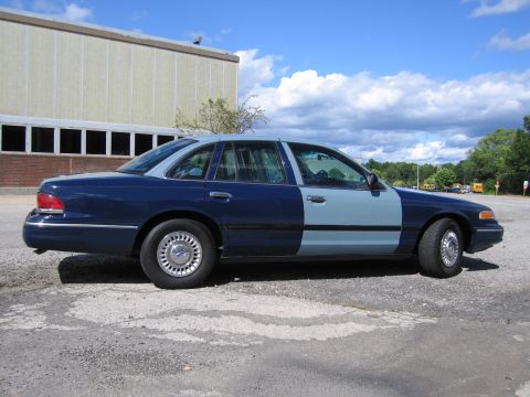 2001 Ford Crown Victoria - Photograph of a two-tone blue Ford Crown Victoria, not a technical document.