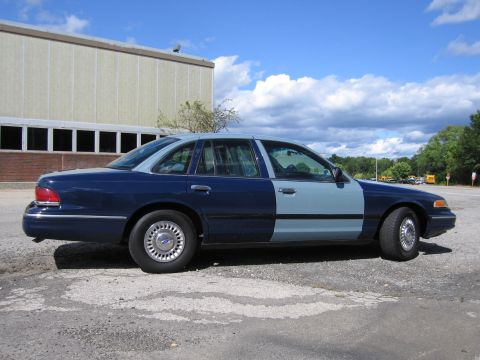 2001 Ford Crown Victoria - Photograph of a two-tone blue Ford Crown Victoria, not a technical document.