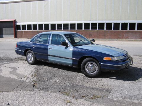 2001 Ford Crown Victoria - Photograph of a two-tone blue Ford Crown Victoria, not a technical document.