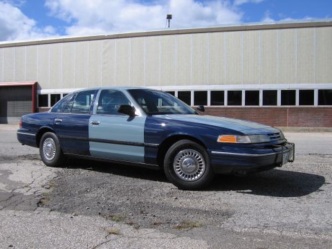 2001 Ford Crown Victoria - Photograph of a two-tone blue Ford Crown Victoria, not a technical document.