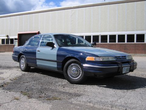 2001 Ford Crown Victoria - Photograph of a two-tone blue Ford Crown Victoria, not a technical document.