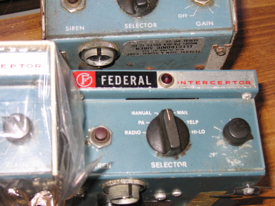 Blue Federal Interceptor siren control head with visible model/serial label
