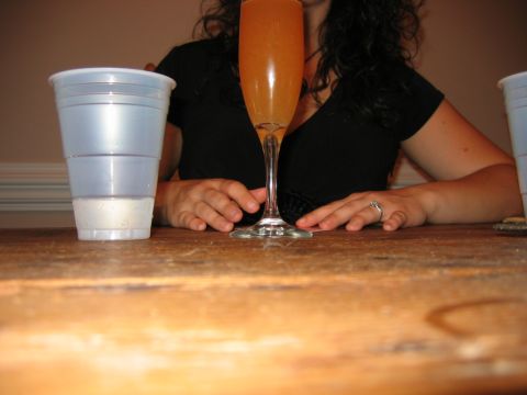 1985 Ford LTD Crown Victoria - Photo of a woman at a table with a glass, not a technical document.