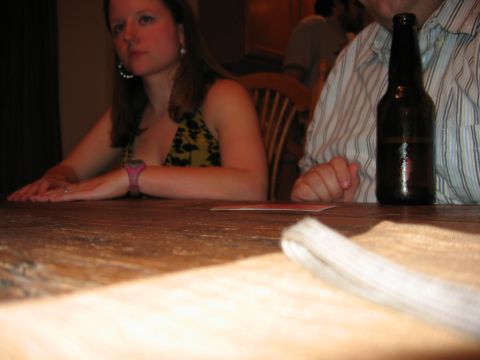 1985 Ford LTD Crown Victoria - Party photo of a woman at a table, not a technical document.
