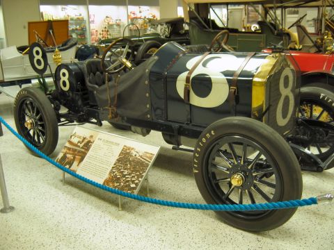 1985 Ford LTD Crown Victoria - Photograph of an antique number 8 racing car displayed in an automobile museum, not a technical document.
