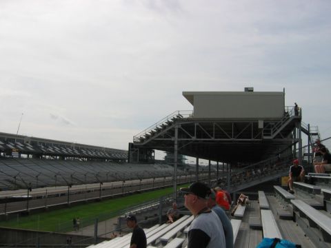 1985 Ford LTD Crown Victoria - Photograph of a motorsport grandstand and timing stand; not a technical document.