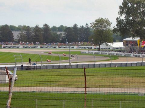 1985 Ford LTD Crown Victoria - Photograph of a motorcycle race in progress; not a technical document.