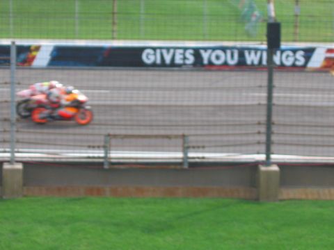 1985 Ford LTD Crown Victoria - Motion-blurred photo of a racing motorcycle on track; not a technical document.