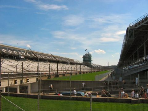 1985 Ford LTD Crown Victoria - Photograph of the Indianapolis Speedway pagoda and grandstands; not a technical document.