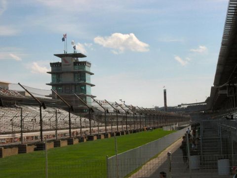1985 Ford LTD Crown Victoria - Photograph of the Indianapolis Speedway pagoda and front straight; not a technical document.