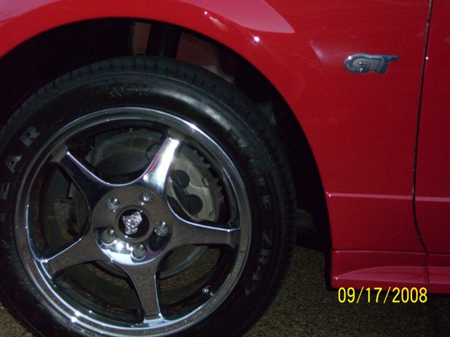 Red Ford Mustang GT front wheel and fender
