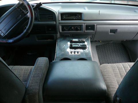 1988 Ford Bronco - The interior of a vehicle, likely a Ford Bronco, shows the dashboard, steering wheel, center console with aftermarket radio and CB radio, a…