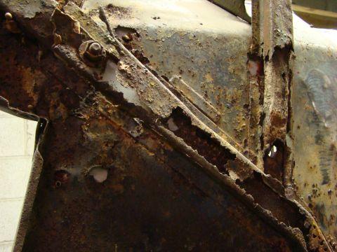 1948 Jeep Wrangler - Close-up view of corroded metal components, indicating extensive rust damage.