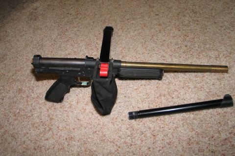 1994 Ford Bronco - Airsoft gun with magazine and detached barrel on carpet.